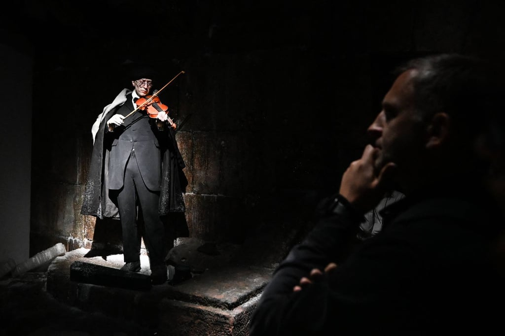 Visitors attend a guided tour at the Museum of Memory, the recently opened institution which replaced the closed Gulag History Museum, in Moscow in August. Photo: AFP