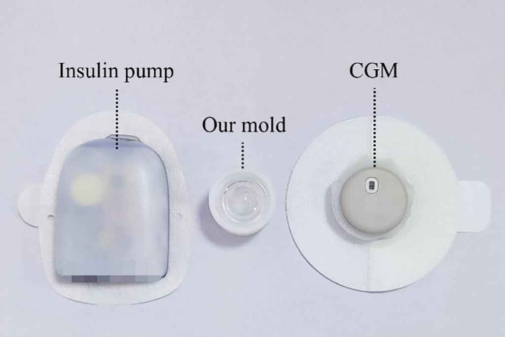 The device (centre) was developed by researchers from the University of Electronic Science and Technology of China. It is flanked by a commercial insulin pump and a commercial continuous glucose monitoring device. Photo: Nature