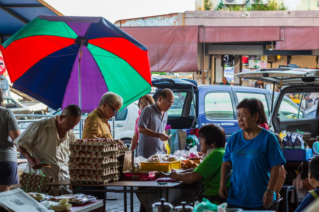 Elderly residents buy and sell goods at the Lido Fresh Market in Kota Kinabalu, Sabah, Malaysia in 2019. Photo: Shutterstock