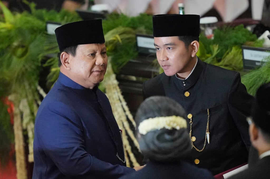 Indonesian President Prabowo Subianto (left) and Vice-President Gibran Rakabuming Raka sign inauguration documents in Jakarta in October 2024. Photo: AP
