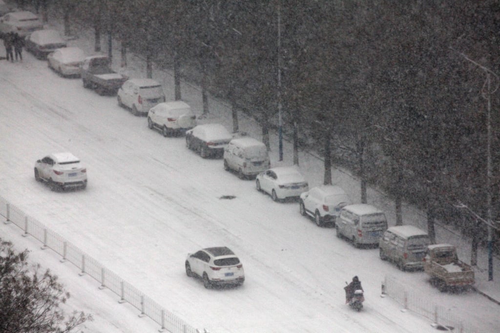 The photo shows vehicles navigating the snow in Henan province, where boss Ma bought her top-performing workers cars after seeing them endure such a harsh winter commute. Photo: Visual China Group via Getty Images