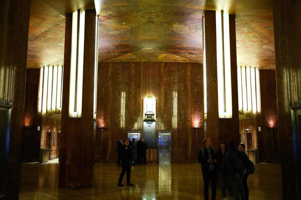 People make their way through the lobby of the Chrysler Building in New York on Wednesday. Photo: AFP People make their way through the lobby of the Chrysler Building in New York on Wednesday. Photo: AFP