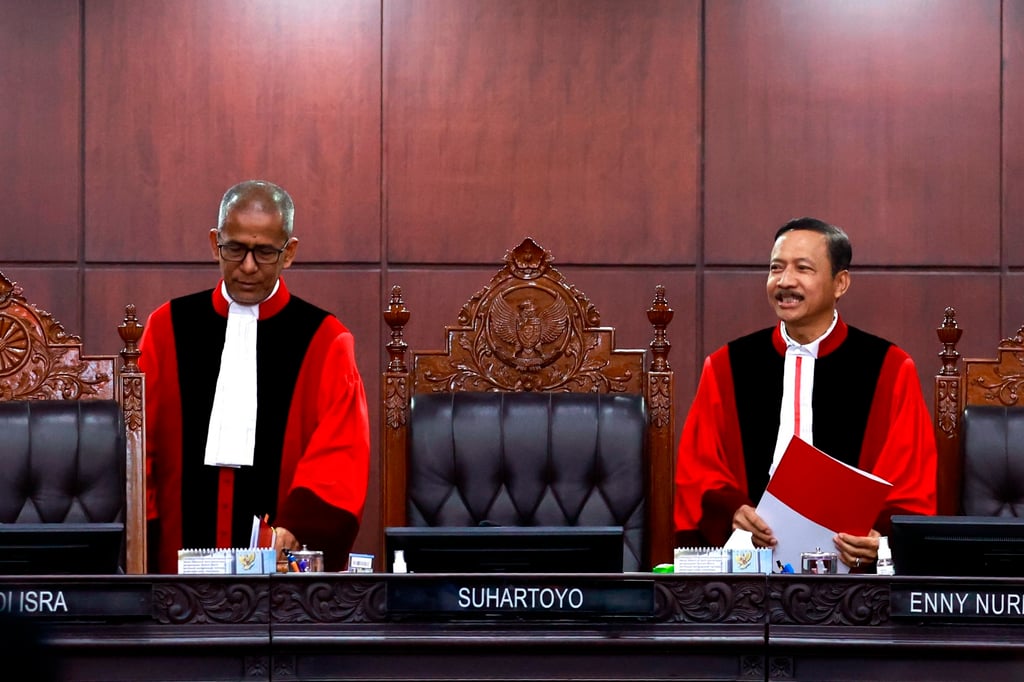 Constitutional Court Chief Justice Suhartoyo (right) and Justice Saldi Isra arrive for a ruling regarding Vice-President Gibran Rakabuming Raka in Jakarta, Indonesia, on Tuesday. Photo: EPA