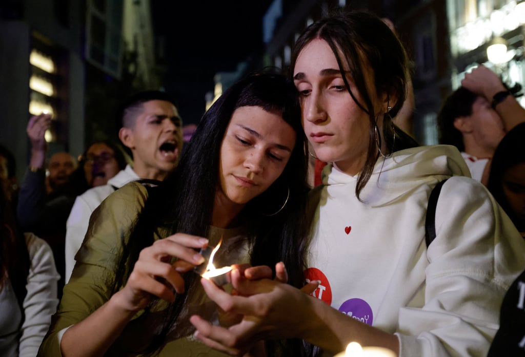 Women light candles as people gather at the protest camp at Puerta del Sol square in Madrid on Wednesday following the death of Maricarmen Abascal, Photo: Reuters Women light candles as people gather at the protest camp at Puerta del Sol square in Madrid on Wednesday following the death of Maricarmen Abascal, Photo: Reuters