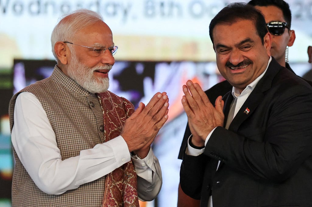 Indian Prime Minister Narendra Modi greets Indian businessman Gautam Adani in Ulwe, India, in October 2025. Photo: Reuters