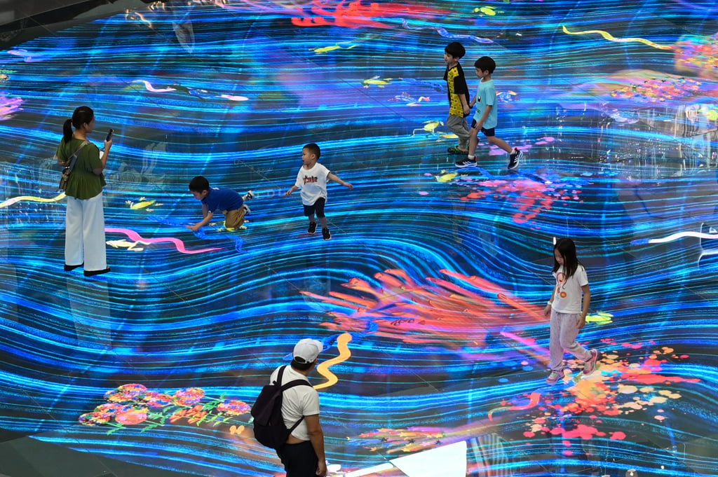 Children play at a shopping centre in Singapore. App stores are now legally required to verify the ages of users in the city state for age-restricted material. Photo: AFP Children play at a shopping centre in Singapore. App stores are now legally required to verify the ages of users in the city state for age-restricted material. Photo: AFP