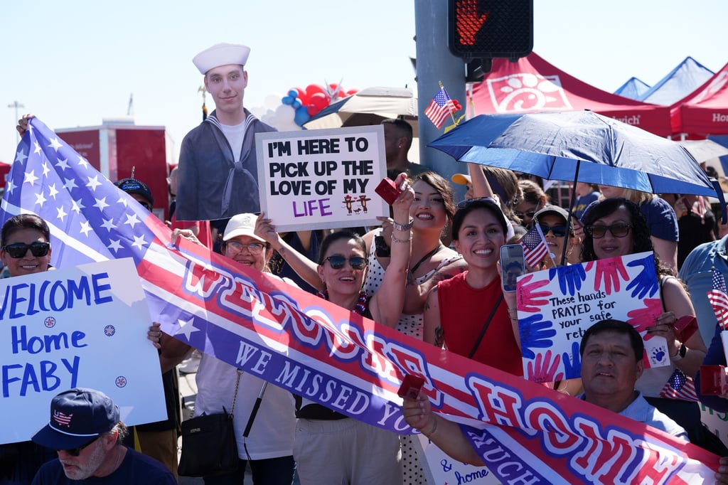 Family and friends wait to greet the USS Abraham Lincoln aircraft carrier as it returns to Naval Air Station North Island after deployment on Thursday in Coronado, California. Photo: AP Family and friends wait to greet the USS Abraham Lincoln aircraft carrier as it returns to Naval Air Station North Island after deployment on Thursday in Coronado, California. Photo: AP