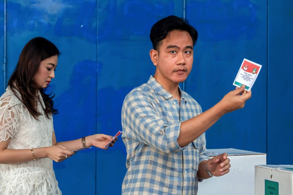 Indonesia’s Vice-President Gibran Rakabuming Raka and his spouse Selvi Ananda show their ballot papers while voting at regional elections in Solo, Central Java, in November 2024. Photo: AFP Indonesia’s Vice-President Gibran Rakabuming Raka and his spouse Selvi Ananda show their ballot papers while voting at regional elections in Solo, Central Java, in November 2024. Photo: AFP