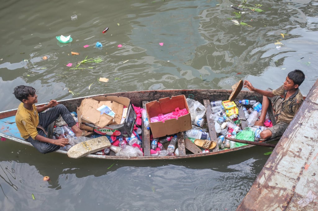 A Bangladeshi child labourer collects plastic waste from the Buriganga River in Dhaka last year. Photo: EPA-EFE