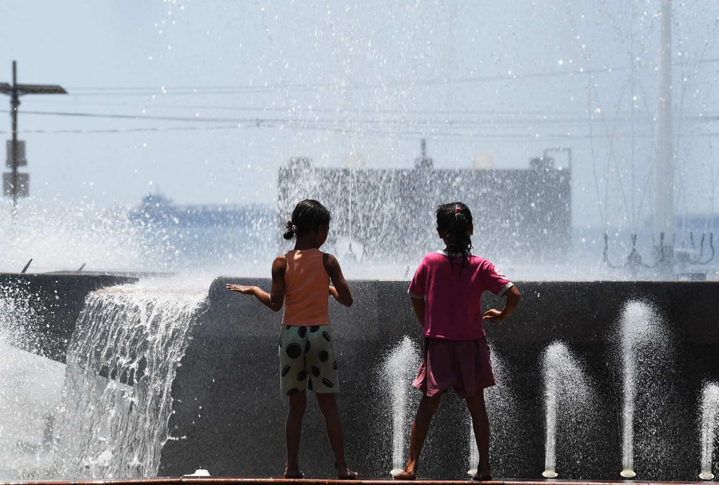 Children play near a fountain at a park in Manila in April. Few observers expect a single, regional law on children’s social media to emerge any time soon. Photo: AFP Children play near a fountain at a park in Manila in April. Few observers expect a single, regional law on children’s social media to emerge any time soon. Photo: AFP