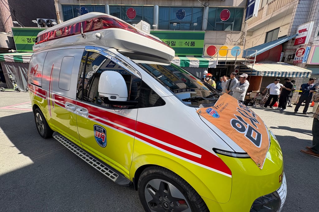 An ambulance and emergency responders outside a building in Daegu, South Korea, on Saturday, following a partial ceiling collapse. Photo: Yonhap/AP