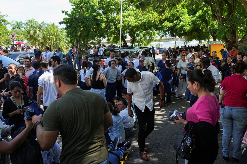 People gather in an open area in Panama City after an earthquake struck near the southern coast of the country on Friday. Photo: Reuters