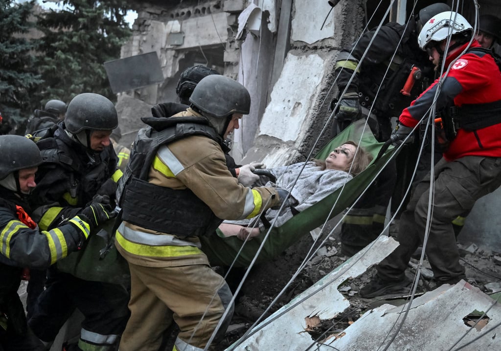 Rescuers evacuate a wounded resident found under debris in Zaporizhzhia, Ukraine, on Saturday. Photo: Reuters