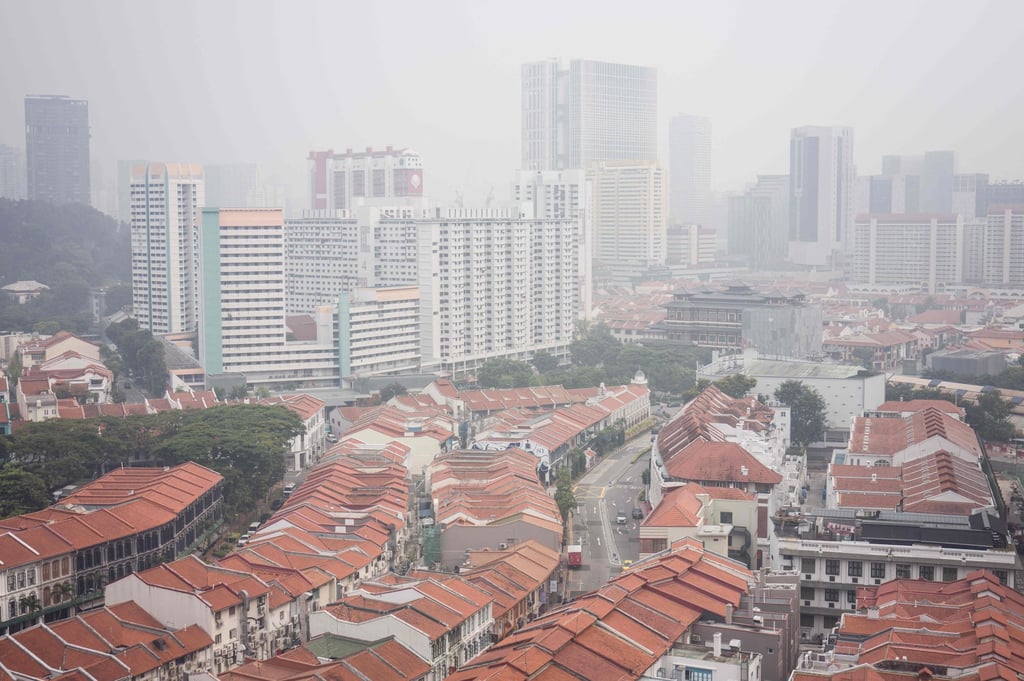 Buildings are seen shrouded by haze in Singapore on Friday. Photo: AFP