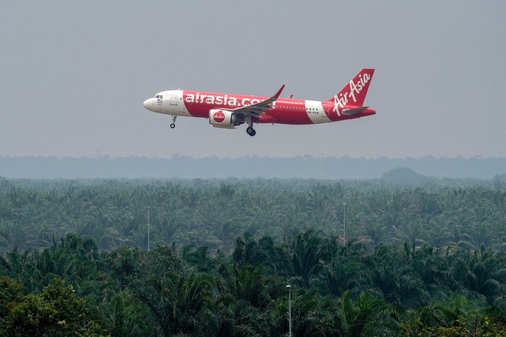 An AirAsia plane takes off at Kuala Lumpur International Airport Terminal 2 in Sepang, Malaysia, last month. AirAsia reported a net loss of 831 million ringgit for the second quarter. Photo: Reuters