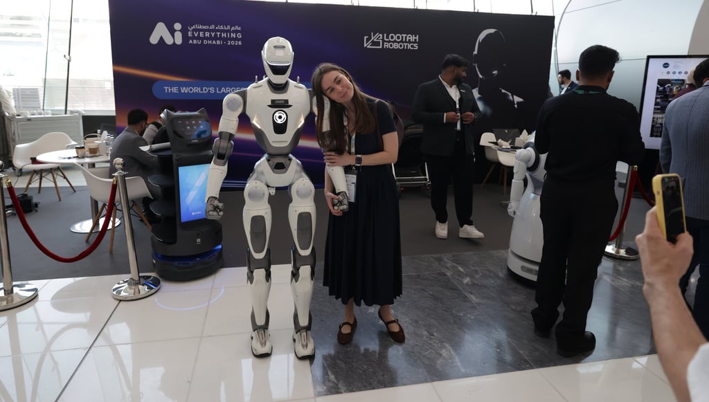 A visitor takes a photo with a robot at the AI Everything Abu Dhabi conference and exhibition earlier this month. The UAE is investing tens of billions to become a global leader in AI and technology. Photo: EPA A visitor takes a photo with a robot at the AI Everything Abu Dhabi conference and exhibition earlier this month. The UAE is investing tens of billions to become a global leader in AI and technology. Photo: EPA
