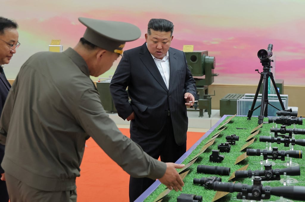 Kim Jong-un is shown a display of scopes and binoculars at the new museum. Photo: KCNA/Reuters Kim Jong-un is shown a display of scopes and binoculars at the new museum. Photo: KCNA/Reuters