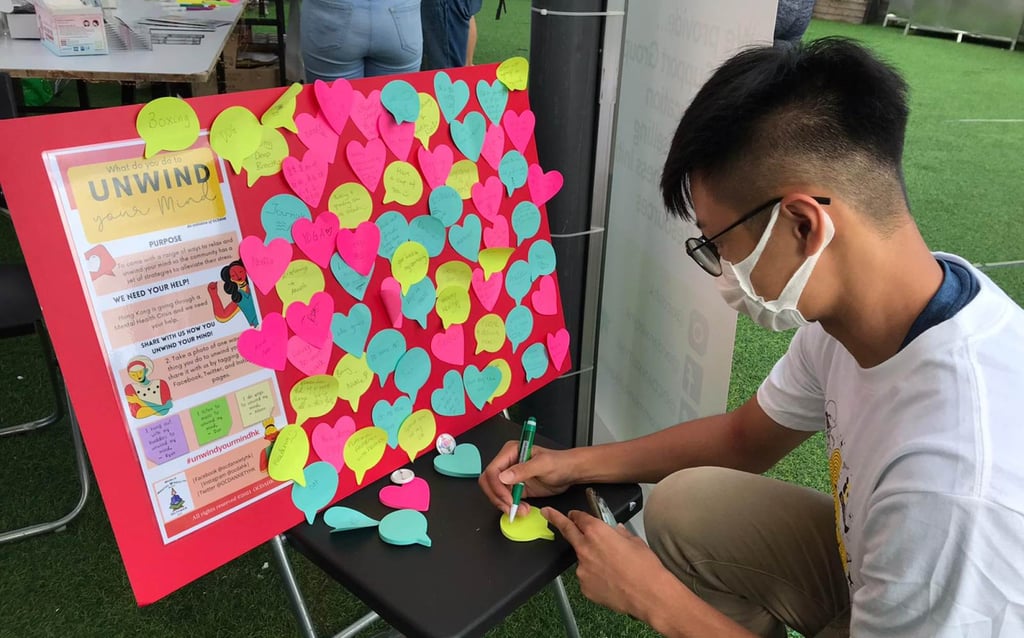 A teenager pens a note of support at a community event organised by OCD & Anxiety Support Hong Kong. Photo: Handout A teenager pens a note of support at a community event organised by OCD & Anxiety Support Hong Kong. Photo: Handout