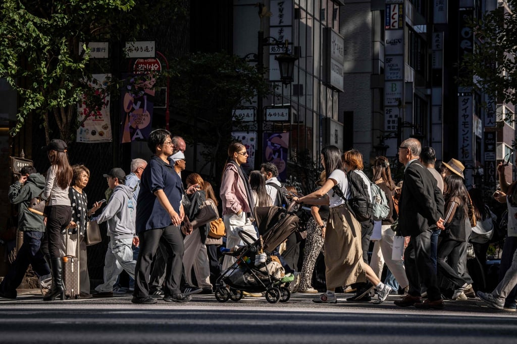 People cross a street in the Ginza area of Tokyo on Thursday last week. A growing number of Japanese see the US as the greatest threat to world peace. Photo: AFP