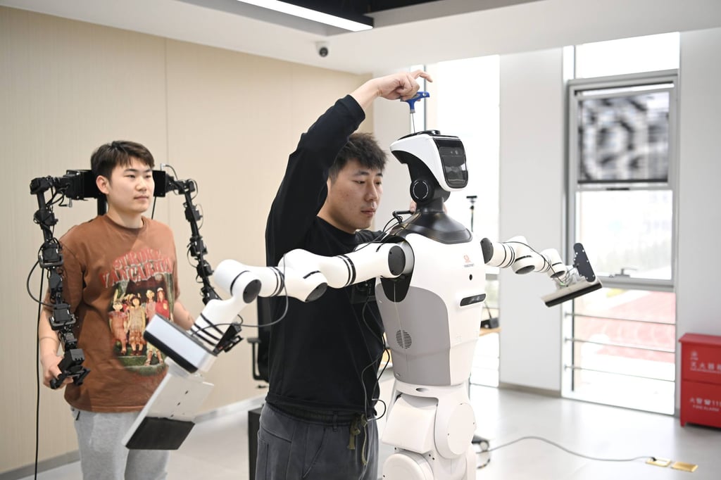 The photo above shows staff members debugging a robot at an embodied AI training facility operated by a digital urban technology subsidiary of China Xiong’an Group in the Xiong’an New Area, a major national development zone in north China’s Hebei province. Photo: Xinhua/Zhu Xudong