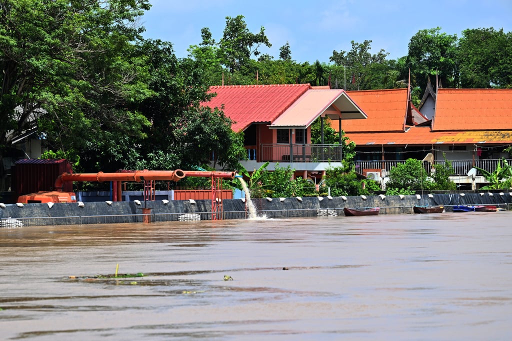 Raised embankments are seen along the side of the swollen Chao Phraya River in Ayutthaya province last month. Photo: Xinhua