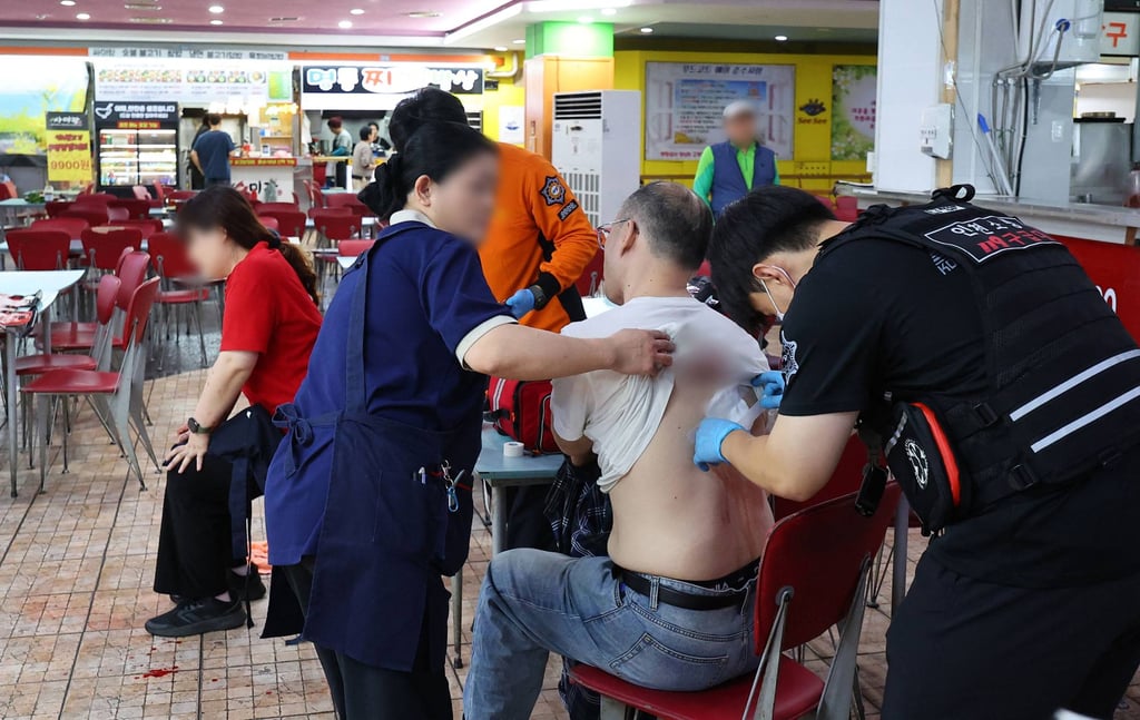 Rescuers treat victims at the scene after a stabbing incident at a supermarket in Incheon, South Korea, on Tuesday. Photo: Yonhap/AFP Rescuers treat victims at the scene after a stabbing incident at a supermarket in Incheon, South Korea, on Tuesday. Photo: Yonhap/AFP