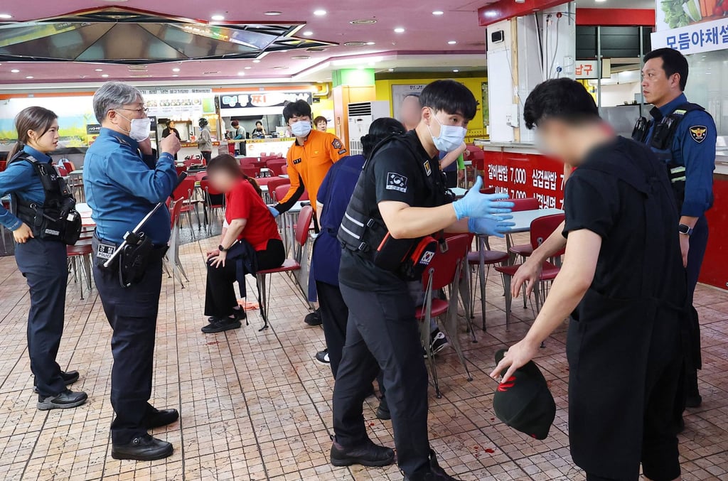 Rescuers treat victims at the scene after a stabbing incident at a supermarket in Incheon, South Korea, on Tuesday. Photo: Yonhap/AFP Rescuers treat victims at the scene after a stabbing incident at a supermarket in Incheon, South Korea, on Tuesday. Photo: Yonhap/AFP