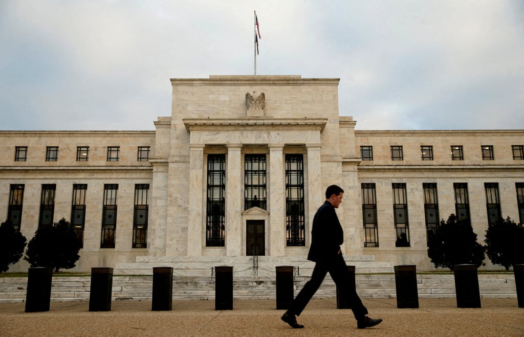 A man walks past the Federal Reserve in Washington in December 2015. Photo: Reuters A man walks past the Federal Reserve in Washington in December 2015. Photo: Reuters