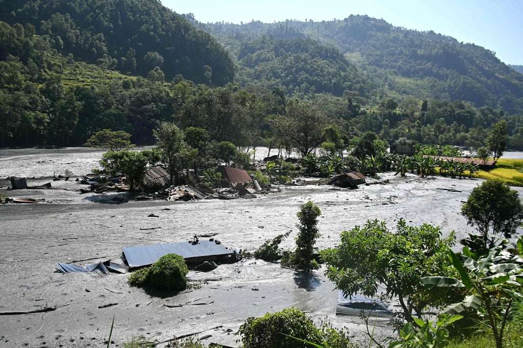 Damaged houses lie partially submerged in sludge along the banks of the Budhi Gandaki river in Nepal’s Gorkha district on Wednesday. Photo: AFP Damaged houses lie partially submerged in sludge along the banks of the Budhi Gandaki river in Nepal’s Gorkha district on Wednesday. Photo: AFP