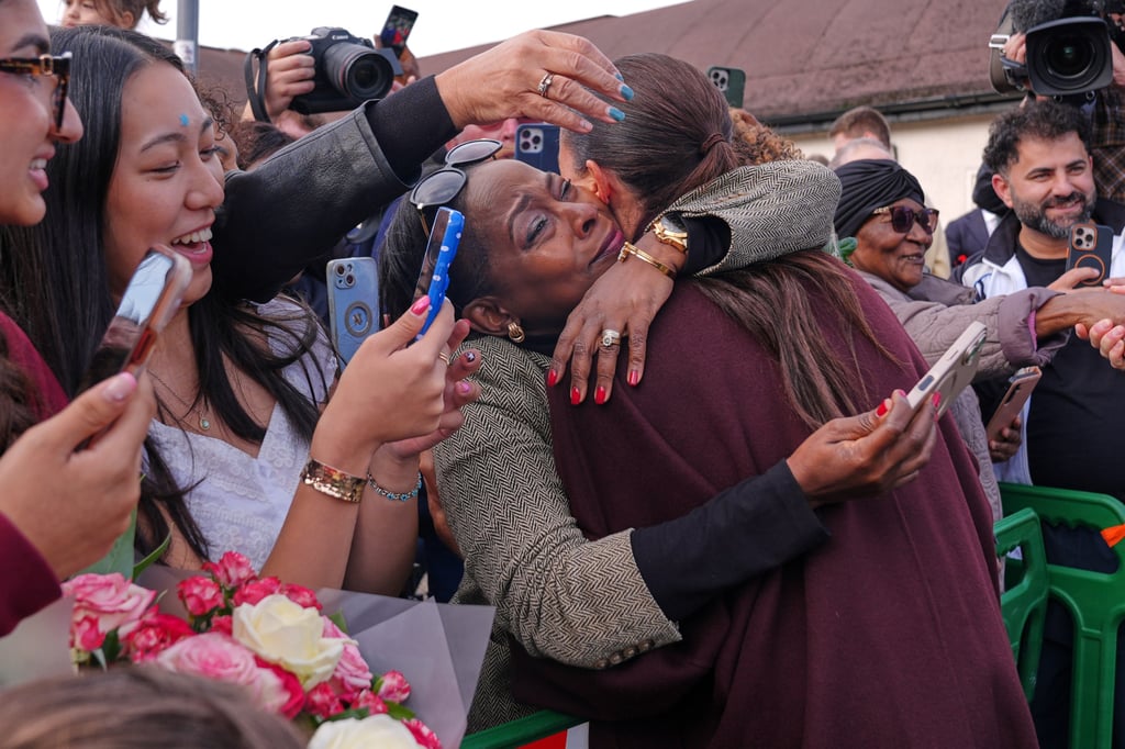 Meghan, Duchess of Sussex, is hugged by a member of the public in Nottingham, England, on Thursday. Photo: AP Meghan, Duchess of Sussex, is hugged by a member of the public in Nottingham, England, on Thursday. Photo: AP