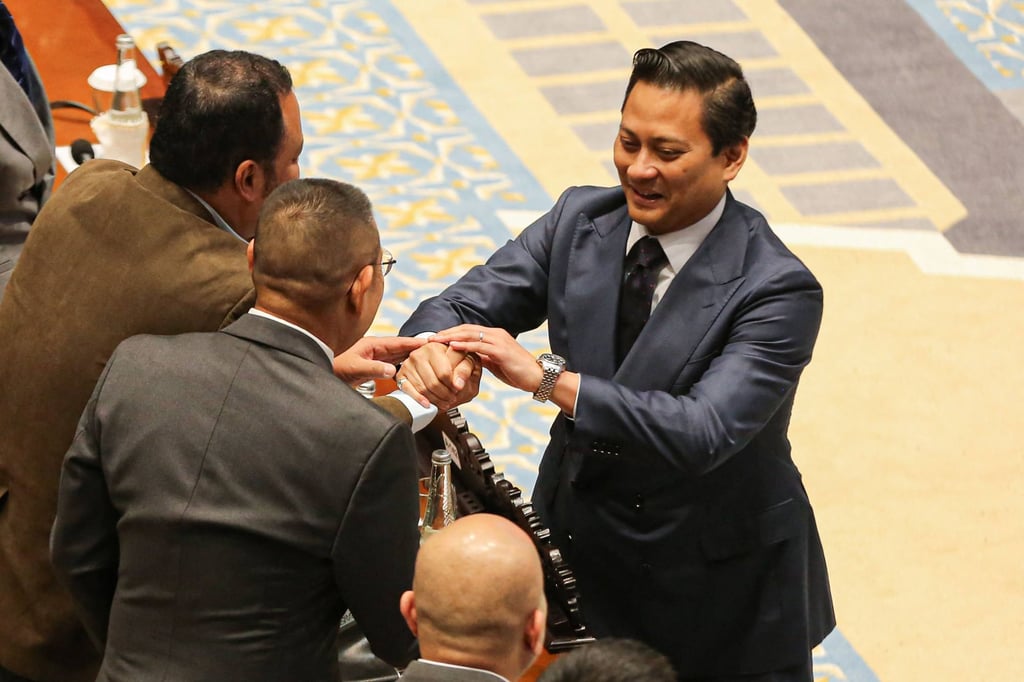 Thomas Djiwandono (right) reacts after lawmakers approve his appointment as deputy governor of the central bank on January 27. Photo: AFP