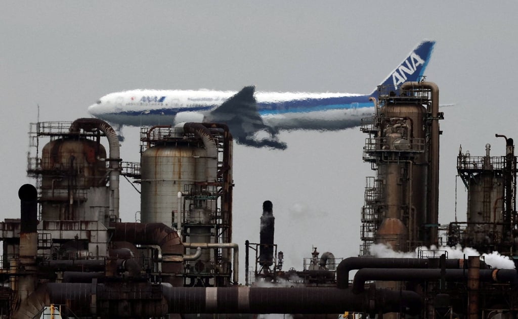 An All Nippon Airways aircraft flies past an oil refinery as it approaches to land at Tokyo’s Haneda airport. Photo: Reuters An All Nippon Airways aircraft flies past an oil refinery as it approaches to land at Tokyo’s Haneda airport. Photo: Reuters