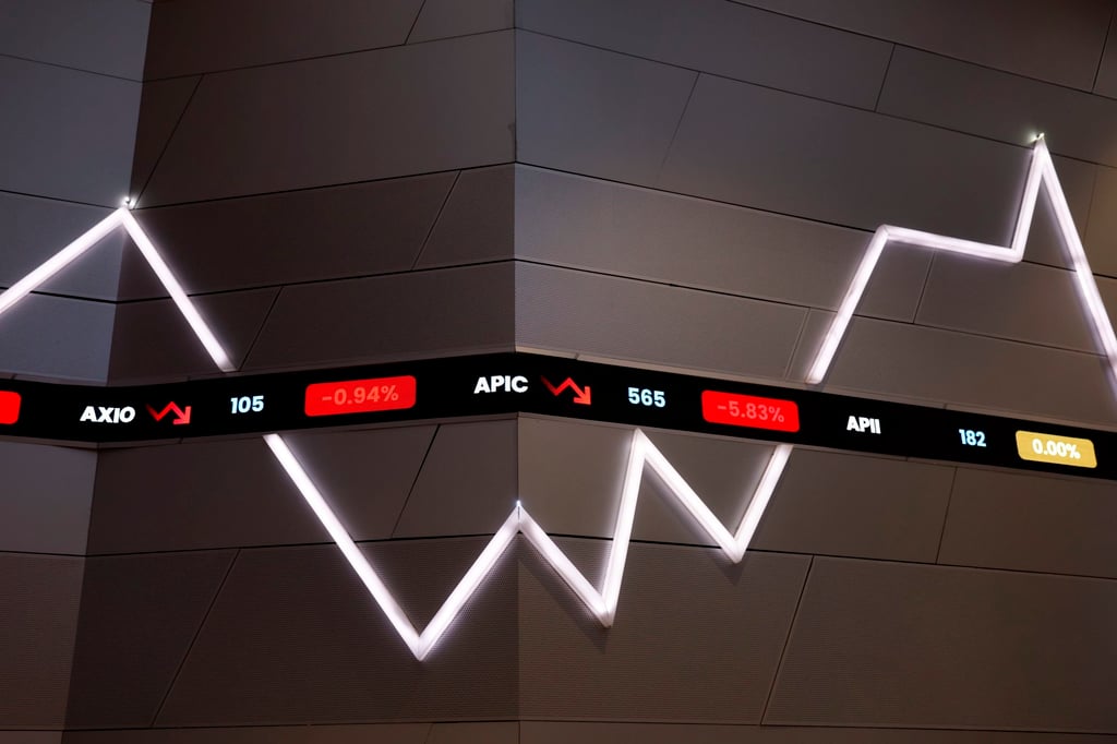 Stock prices are displayed on an LCD board at the Indonesian Stock Exchange building in Jakarta in June. Photo: EPA