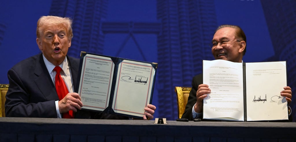 US President Donald Trump (left) and Malaysia’s Prime Minister Anwar Ibrahim hold up signed documents on a bilateral trade deal on the sidelines of the Asean summit in Kuala Lumpur on October 26, 2025. Photo: AFP US President Donald Trump (left) and Malaysia’s Prime Minister Anwar Ibrahim hold up signed documents on a bilateral trade deal on the sidelines of the Asean summit in Kuala Lumpur on October 26, 2025. Photo: AFP