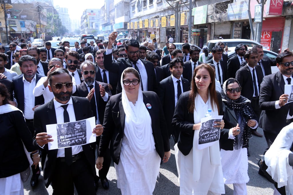 Lawyers supporting the PTI party take part in a protest against the imposition of emergency measures and governor’s rule in Khyber Pakhtunkhwa, in Karachi, Pakistan, on Wednesday. Photo: EPA
