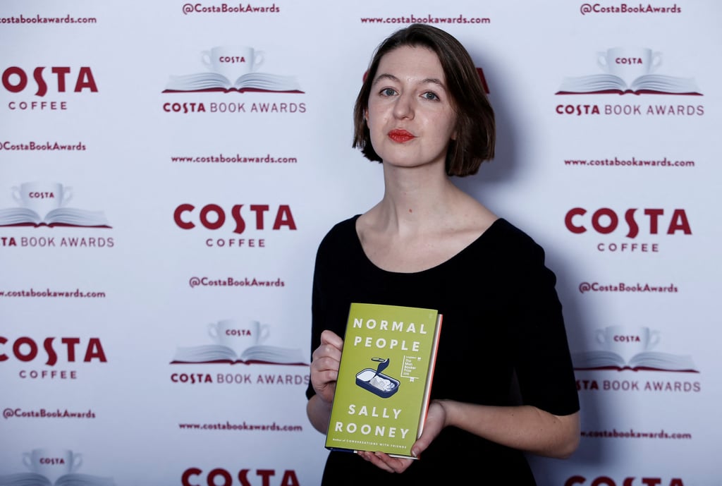 Sally Rooney poses with her book Normal People at the Costa Book Awards event in London on January 29, 2019. Last September, she cancelled a trip to the UK to accept a literary prize for fear of being arrested. Photo: Reuters Sally Rooney poses with her book Normal People at the Costa Book Awards event in London on January 29, 2019. Last September, she cancelled a trip to the UK to accept a literary prize for fear of being arrested. Photo: Reuters