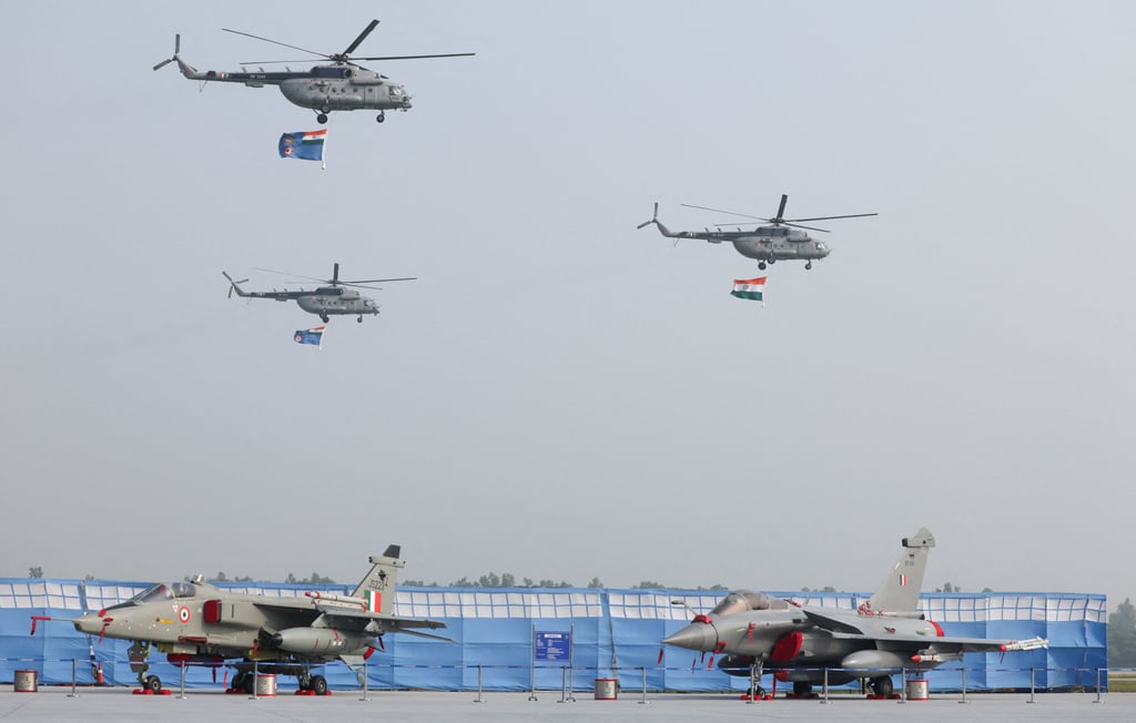 Fighter jets are parked as the Indian Air Force’s Mi-17 helicopters perform during the 94th Air Force Day parade in Ghaziabad on October 8. Photo: Reuters