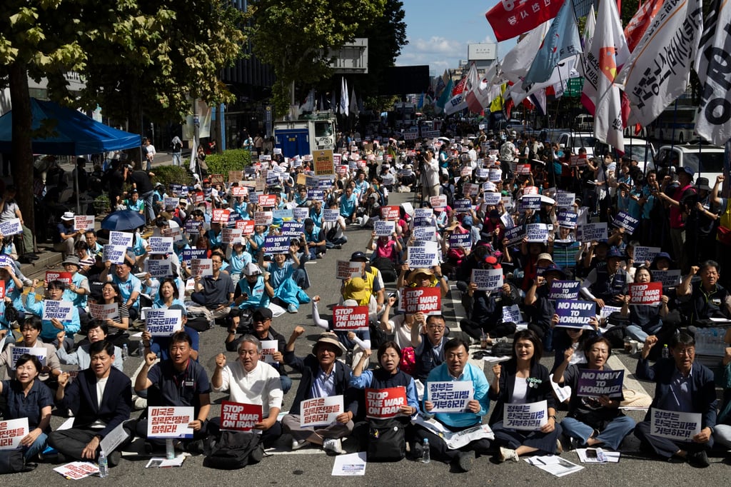 Members of civic groups shout slogans during a rally against Trump’s pressure on South Korea to send troops to the Strait of Hormuz, near the US embassy in Seoul, last month. Photo: EPA