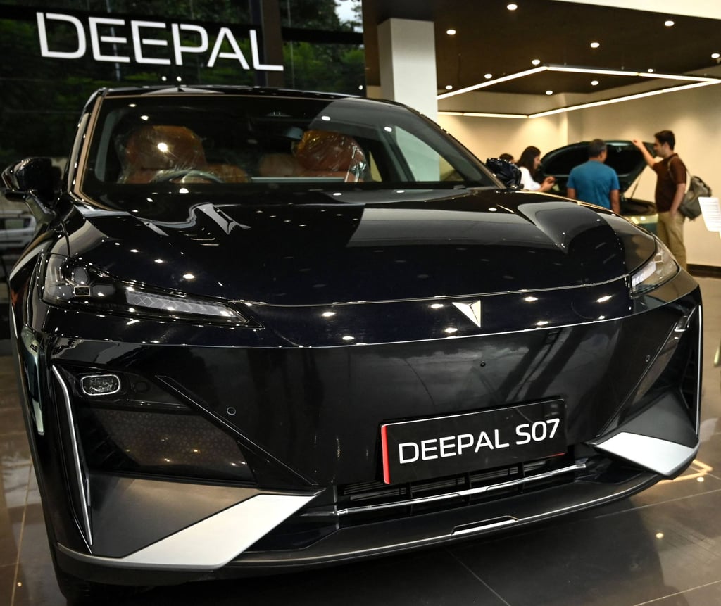 Visitors look at electric vehicles by Chinese carmaker Deepal at its showroom in Kathmandu, Nepal, on September 13, 2024. Photo: AFP