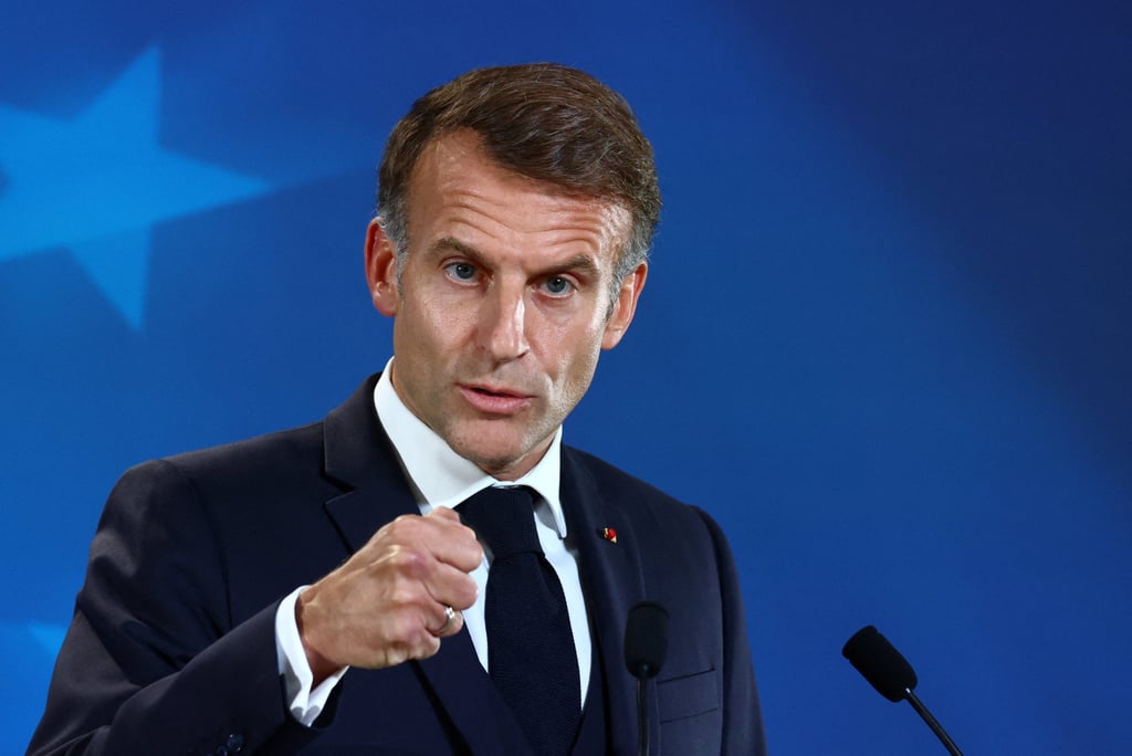 French President Emmanuel Macron gestures during his post-summit press conference in Brussels. Photo: Reuters