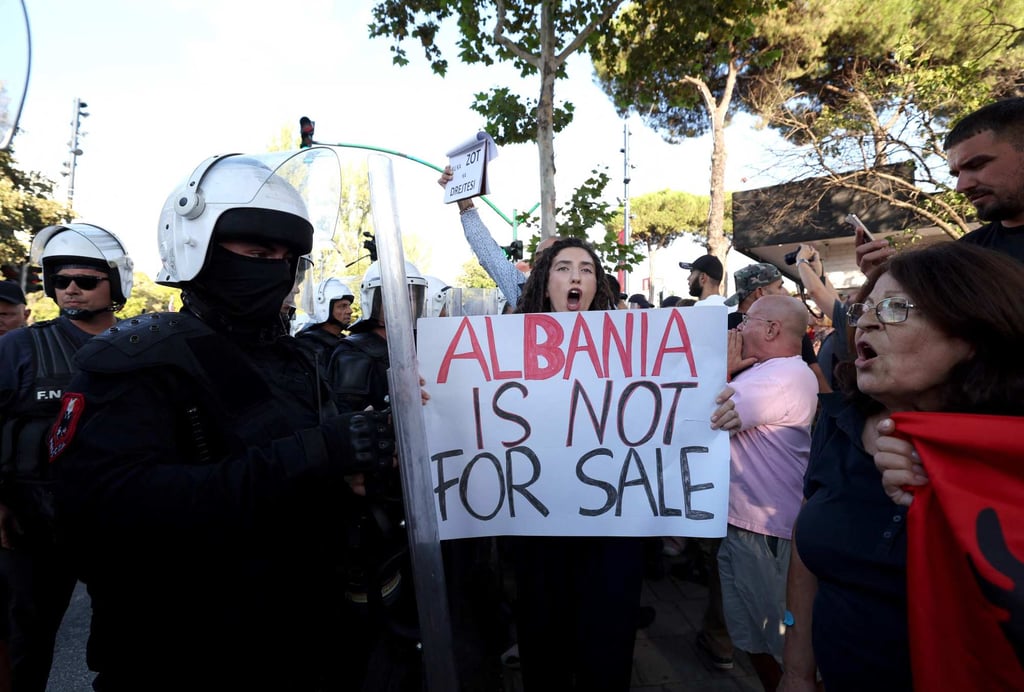 Protesters confront riot police in Tirana on September 30. Photo: AFP