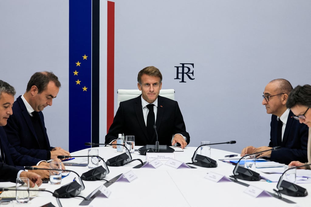 French President Emmanuel Macron (centre) chairs an Interministerial Crisis Meeting at the Elysee Presidential Palace in Paris on Sunday. Photo: Pool via Reuters