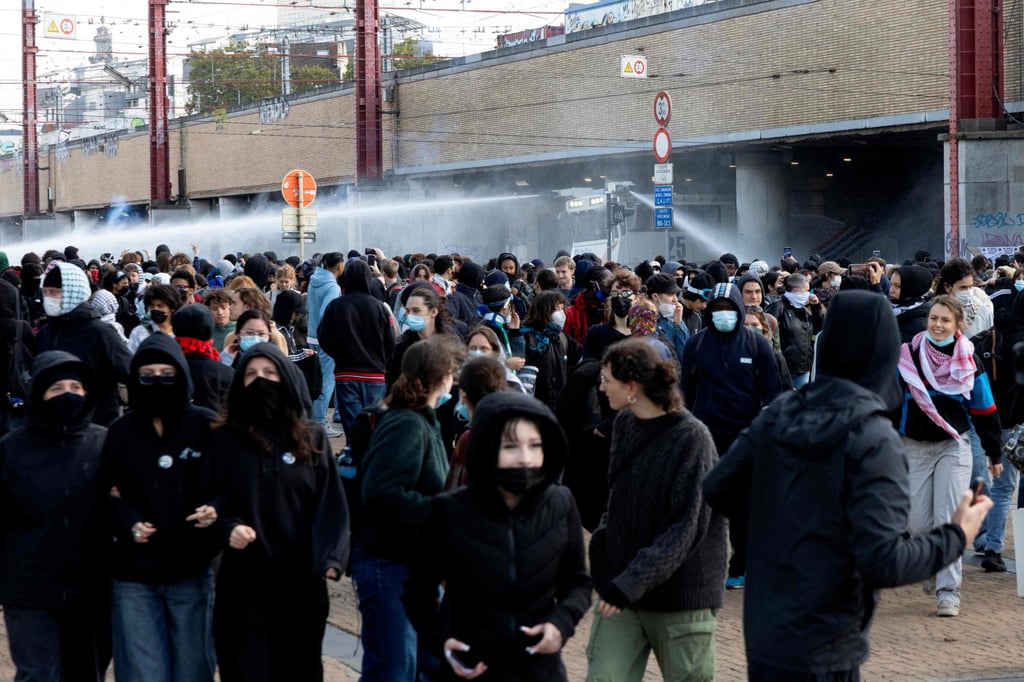 Riot police use a water cannon as protesters gather in Brussels on Saturday. Photo: AFP Riot police use a water cannon as protesters gather in Brussels on Saturday. Photo: AFP