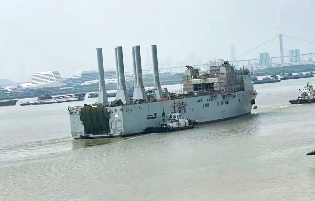 Although the hull shape of the vessel spotted in the Pearl River differs to that in a Shanghai shipyard, both feature raised deckhouses towards the bow, hangar-like spaces and large openings at the stern. Photo: Handout Although the hull shape of the vessel spotted in the Pearl River differs to that in a Shanghai shipyard, both feature raised deckhouses towards the bow, hangar-like spaces and large openings at the stern. Photo: Handout