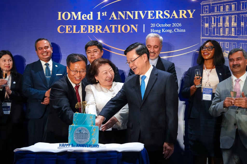 Cui Jianchun (front left), Teresa Cheng and John Lee cut an anniversary cake as other dignitaries join the celebrations. Photo: Kit Lai Cui Jianchun (front left), Teresa Cheng and John Lee cut an anniversary cake as other dignitaries join the celebrations. Photo: Kit Lai
