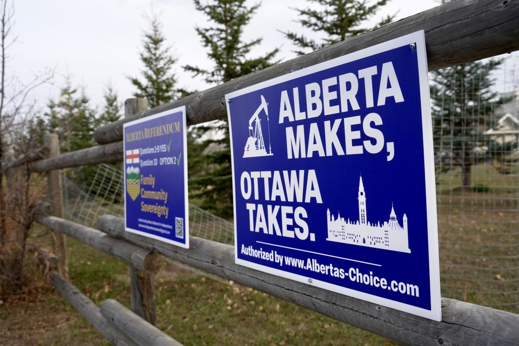 Political signs are posted on a property’s fence in Wainwright, Alberta, Canada on Monday. Photo: AP Political signs are posted on a property’s fence in Wainwright, Alberta, Canada on Monday. Photo: AP