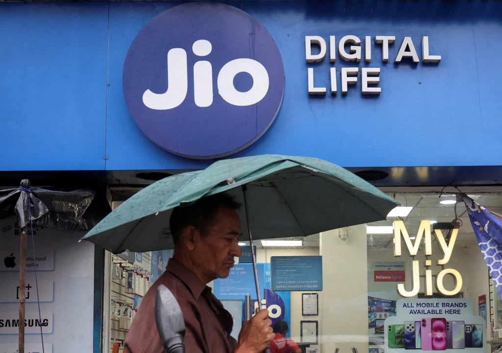 A man passes a Reliance Industries Jio Digital Life store in Kolkata, India, in June. Photo: Reuters