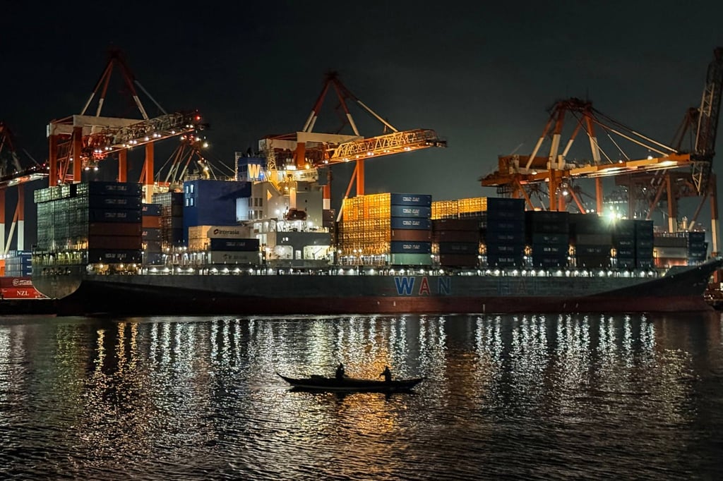 A cargo ship unloading containers at Manila’s international port. Asean is targeting to sign the Digital Economy Framework Agreement at its summit in Manila in November. Photo: AFP