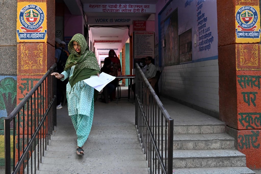 A woman leaves after submitting documents to the Election Commission of India on Sunday. Photo: AFP A woman leaves after submitting documents to the Election Commission of India on Sunday. Photo: AFP