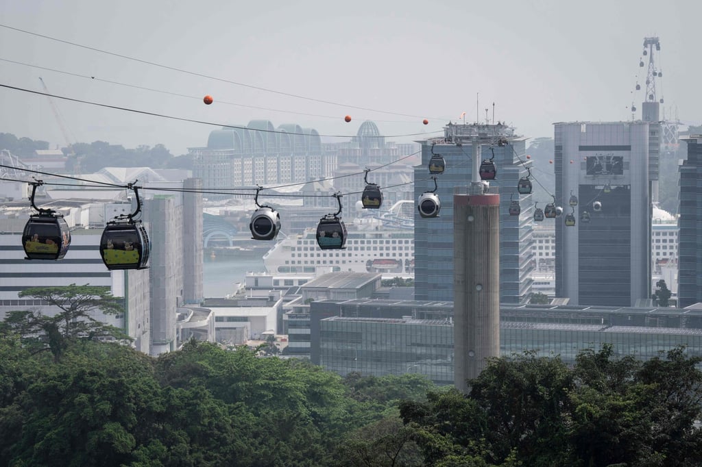 Cable cars travel between Mount Faber and Sentosa Island in Singapore on Saturday, as the country continues to be shrouded in haze caused by fires in Indonesia. Photo: AFP